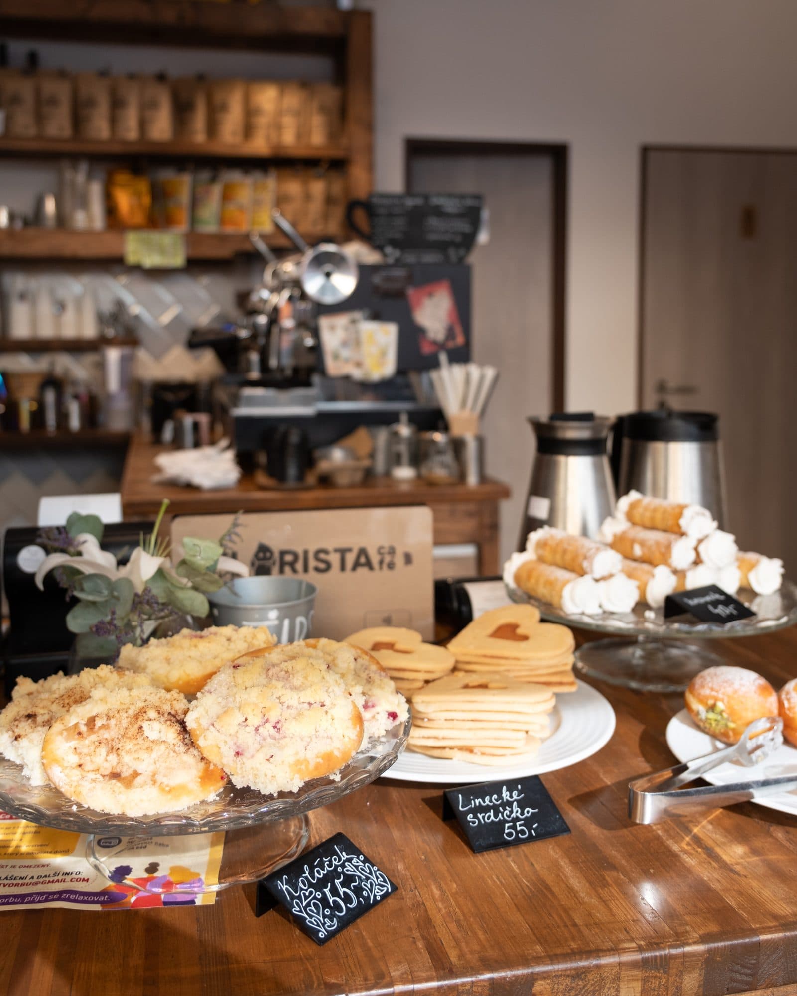 The bar with the espresso machine, croissants and other pastries
