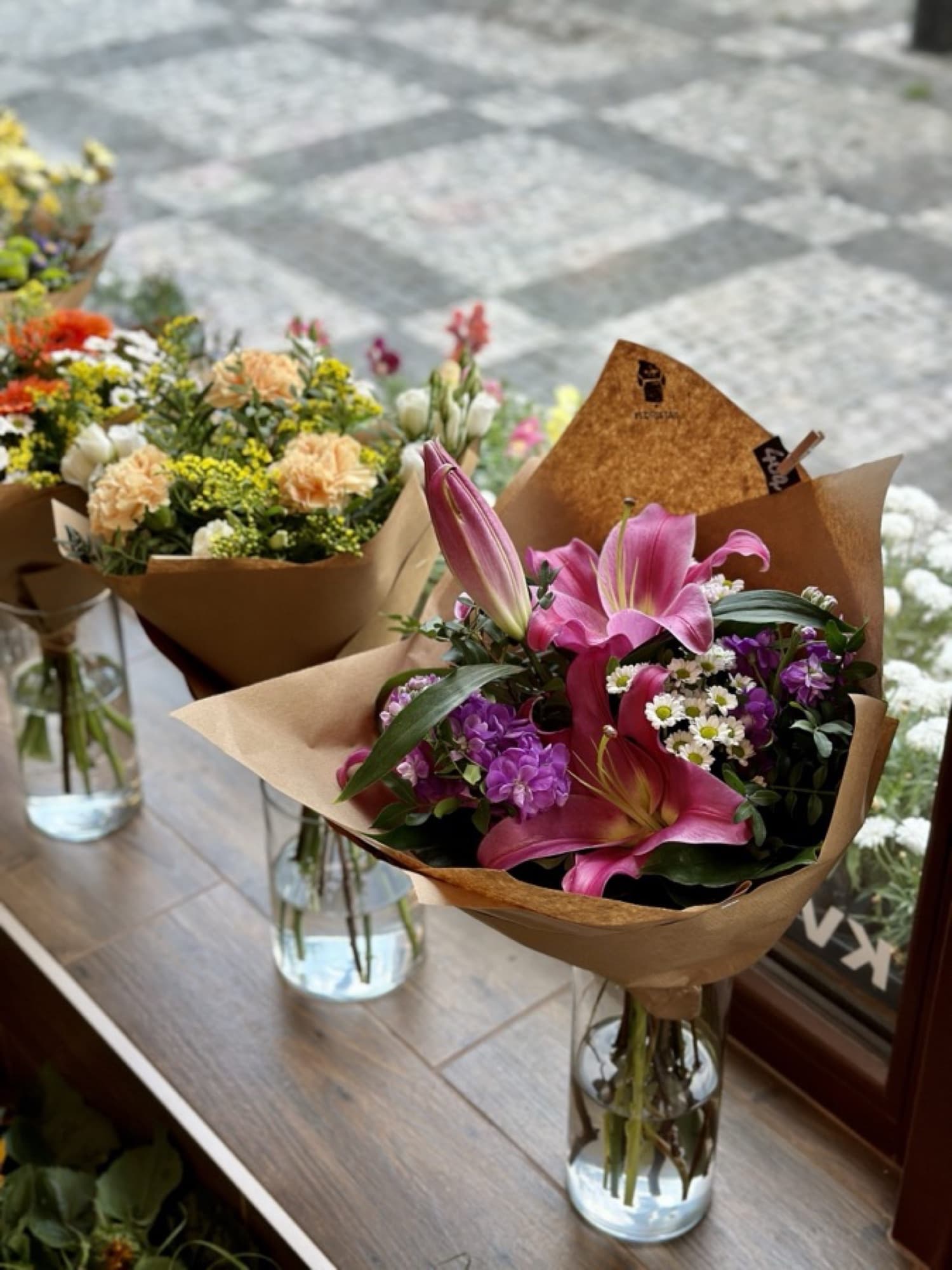 Bouquets in glass vases in the Florista shop window